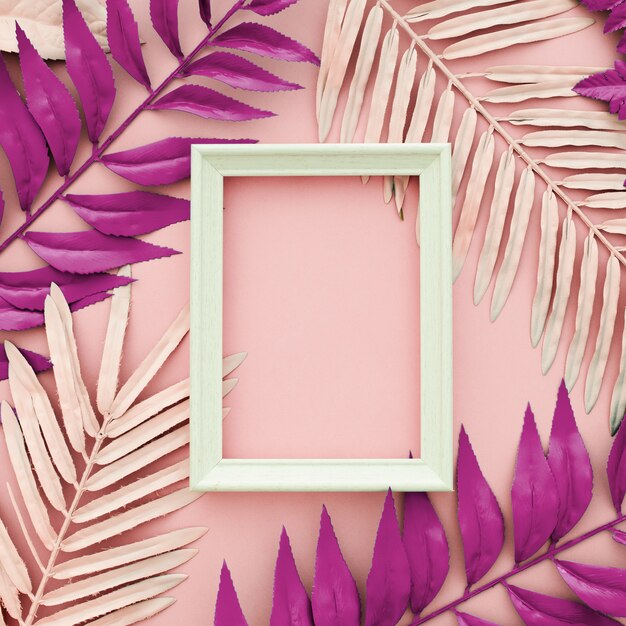 Pink leaves  dyed on pink background with a white frame