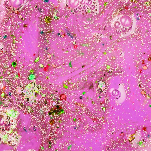 Pink liquid with green crumbs