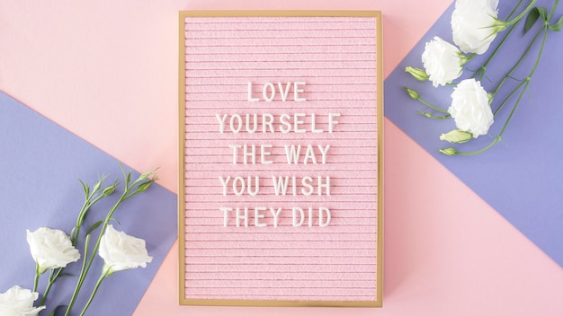 Free photo pink motivational text board above view