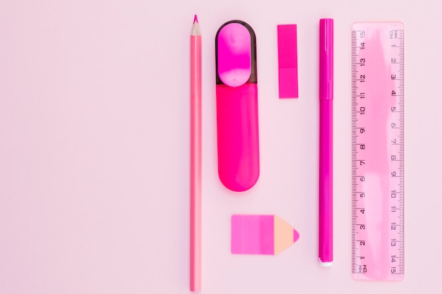 Free photo pink office stationery layout