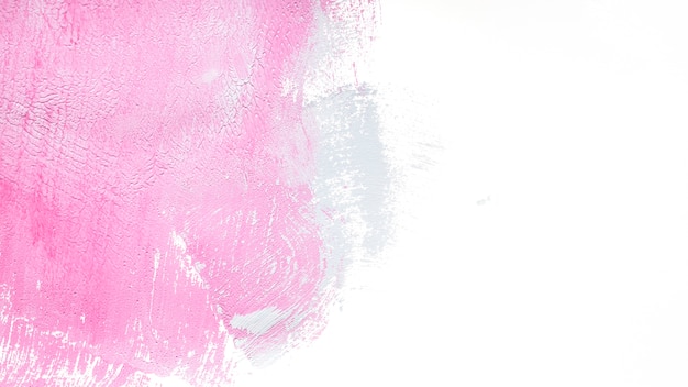 Foto gratuita vernice rosa su bianco nella trama
