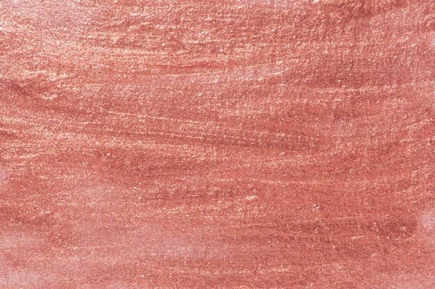 ピンクの塗られた織り目加工の壁の背景