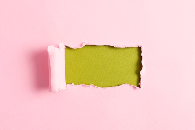 Pink paper sheet with green mock-up