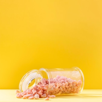 Pink pebbles in transparent jar