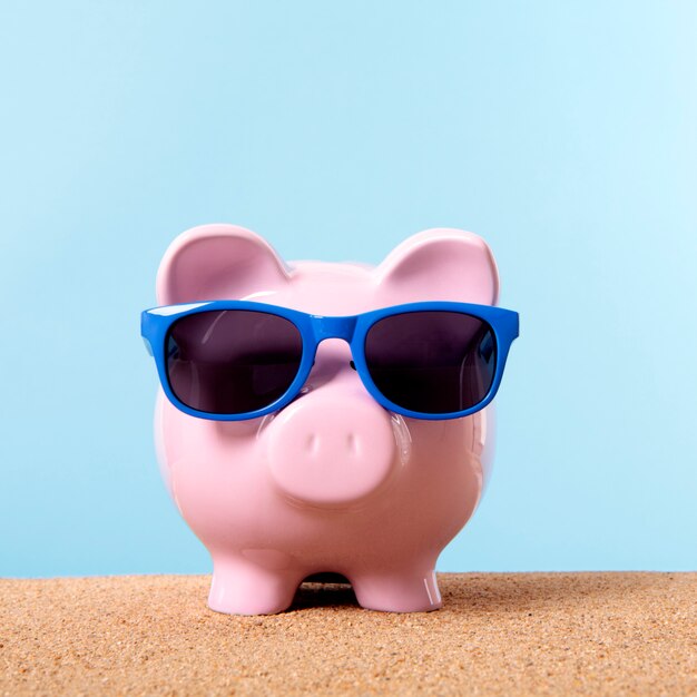 Pink piggy bank beach travel vacation savings sunglasses.