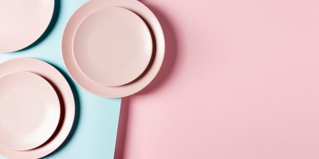 Pink plates arrangement with copy space