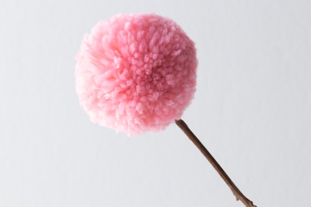 Pink pom pom with white background