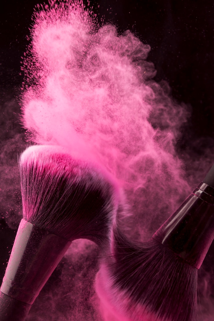 Free Photo pink powder spread with brushes rubbing each other