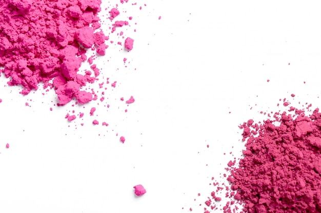 Pink powder on white background, Holi festival concept