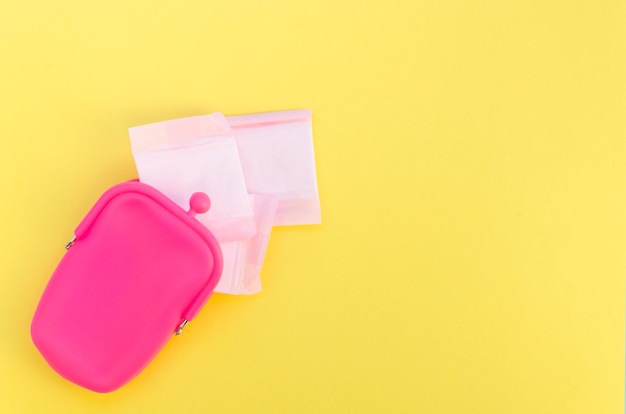 Pink purse with wrapped sanitary napkins