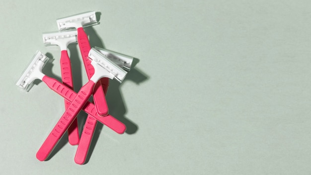 Pink razor blades copy space