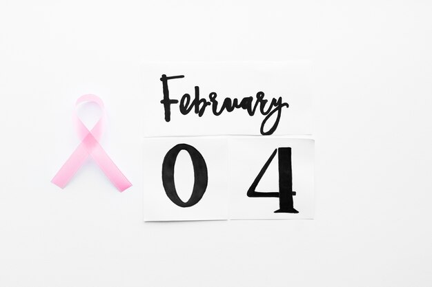Pink ribbon near February 4 writing