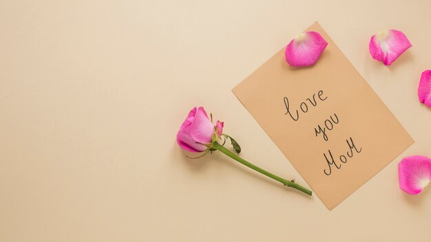 Pink rose flower with Love you Mom inscription 