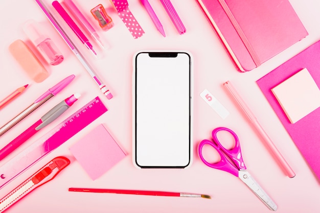 Pink school stationery with phone in center