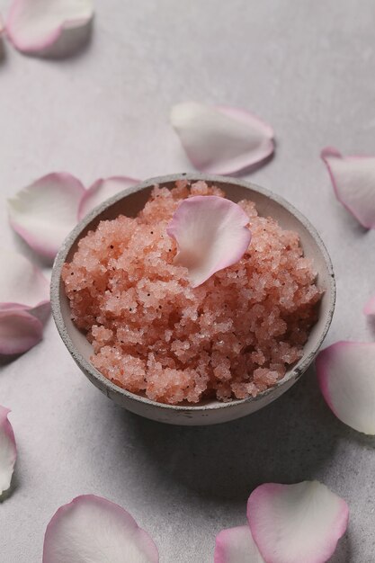 Pink sea salt and rose petals. Cosmetology and spa