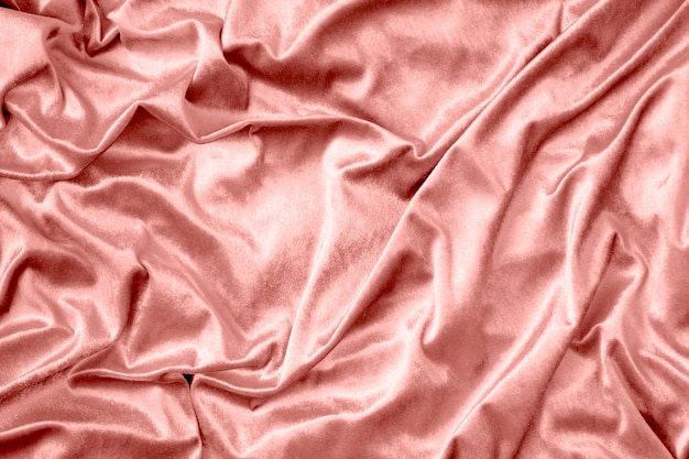 Розовая блестящая текстура ткани из шелка
