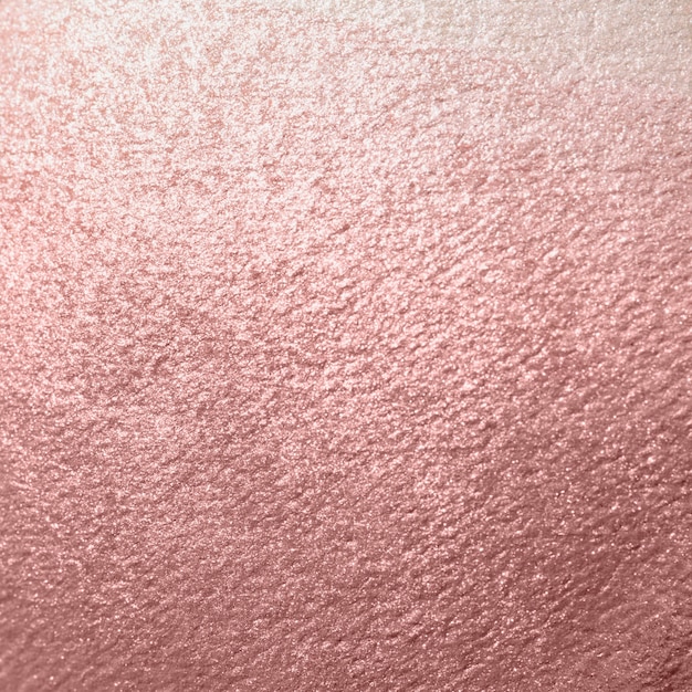 Free photo pink shiny textured paper background