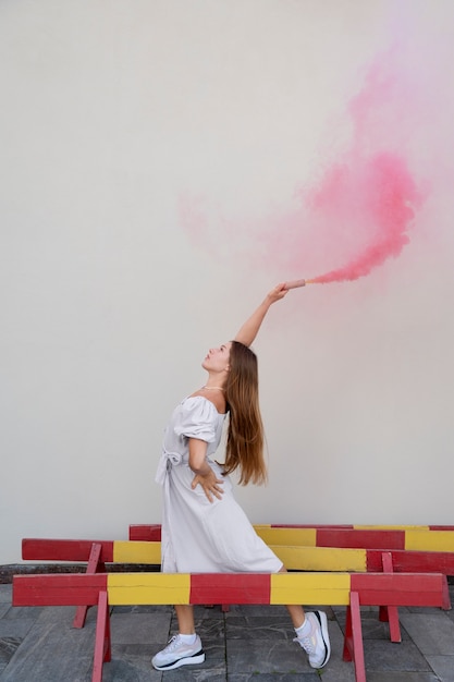 Free photo pink smoke background with young adult