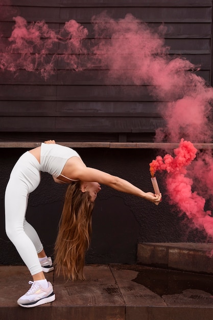 Free photo pink smoke background with young adult