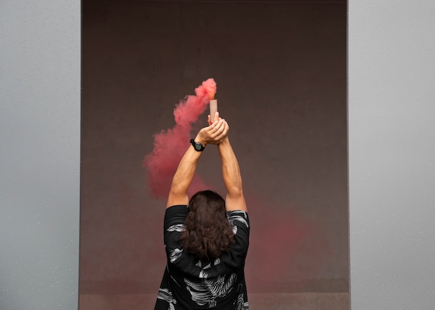 Pink smoke background with young adult