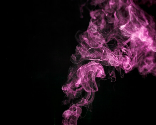 Pink smoke on black background