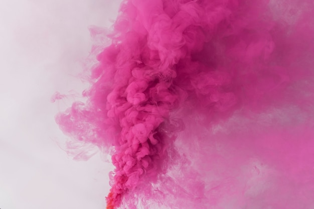 Pink smoke effect on a white wallpaper