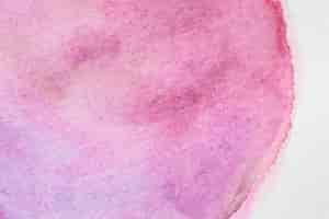 Бесплатное фото Розовое пятно ручной работы в технике акварели