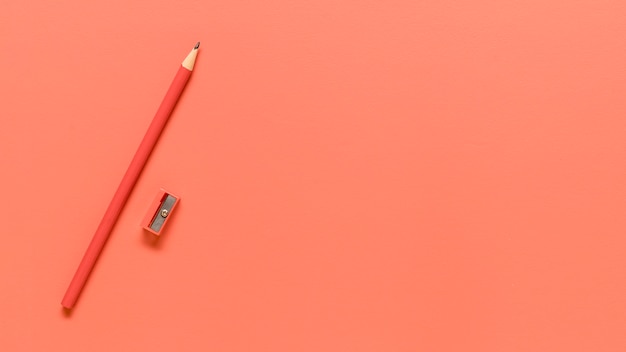 Pink stationery on colored surface