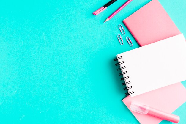 Pink stationery on colored surface