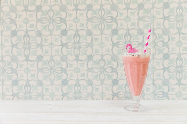 Pink summer smoothie with copyspace on left