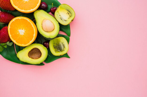 Pink surface with delicious summer fruits