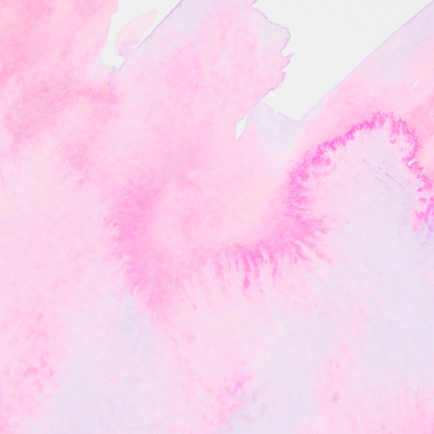紙の背景にピンクの水彩ブラシストローク