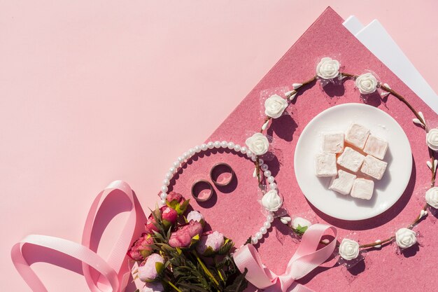 Pink wedding decoration with flower crown and copy space