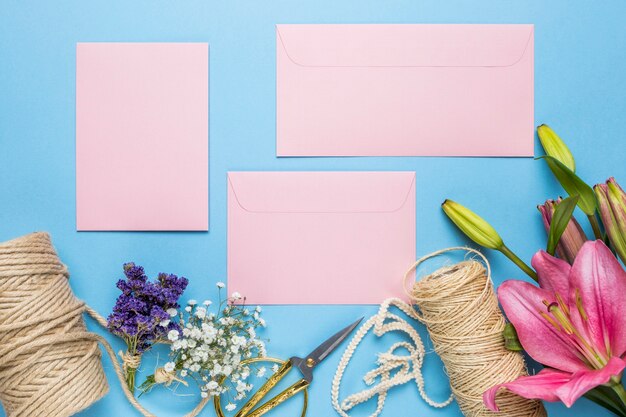 Pink wedding invitations on blue background
