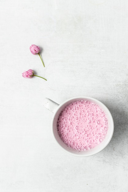 Pink and white ceramic mug with pink liquid