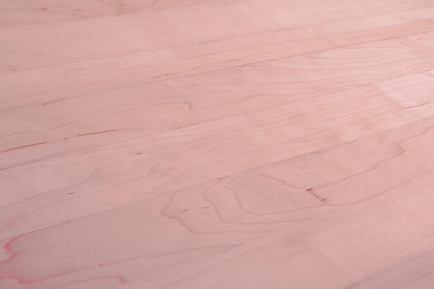 ピンクの木製の織り目加工の床の背景