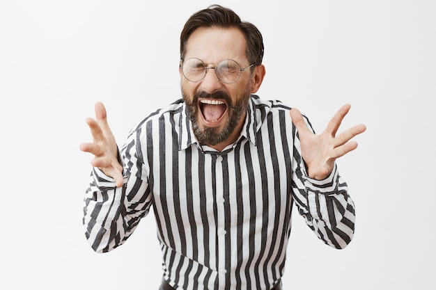 Free photo pissed-off and outraged bearded mature man posing