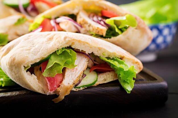 Pita stuffed with chicken, tomato and lettuce