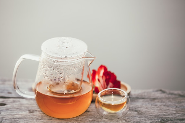 Free photo pitcher and glass full of hot tea