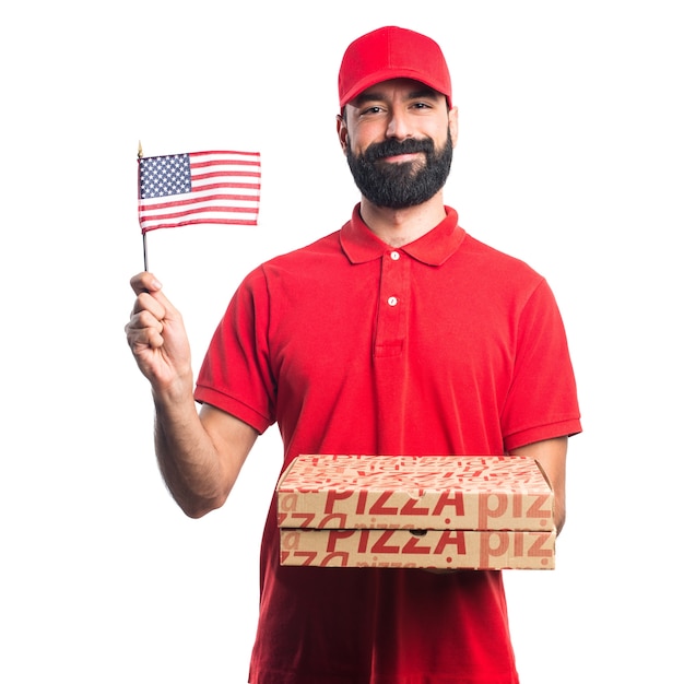 アメリカの旗を持っているピザの配達人