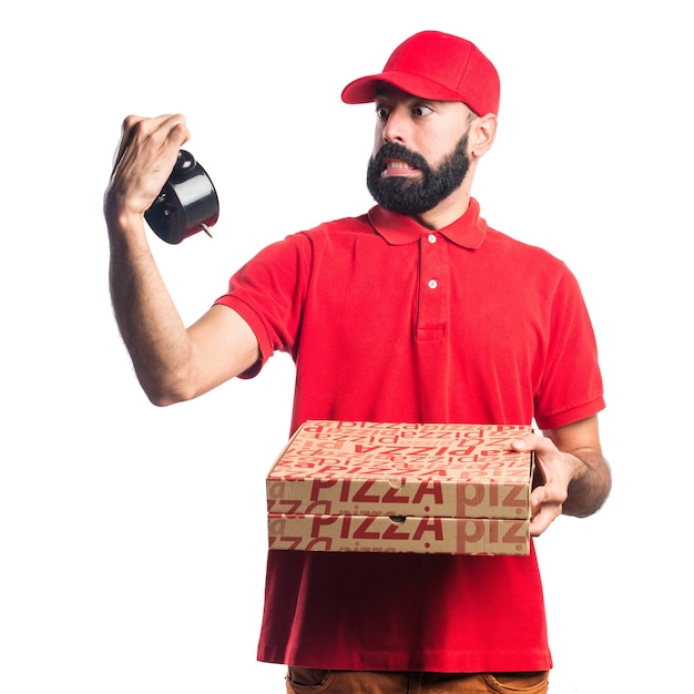 Uomo di consegna pizza che tiene orologio d'epoca