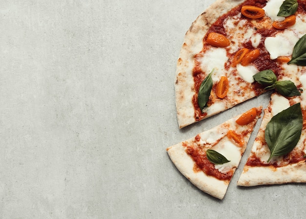 Free photo pizza on gray surface