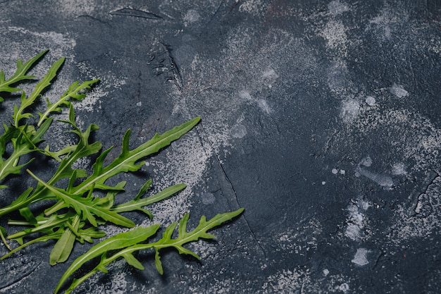 Pizza Ingredients on Dark Concrete Background: A Mouthwatering Neapolitan Pizza Cooking Concept