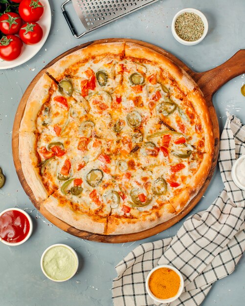 Pizza pepperoni on wooden board