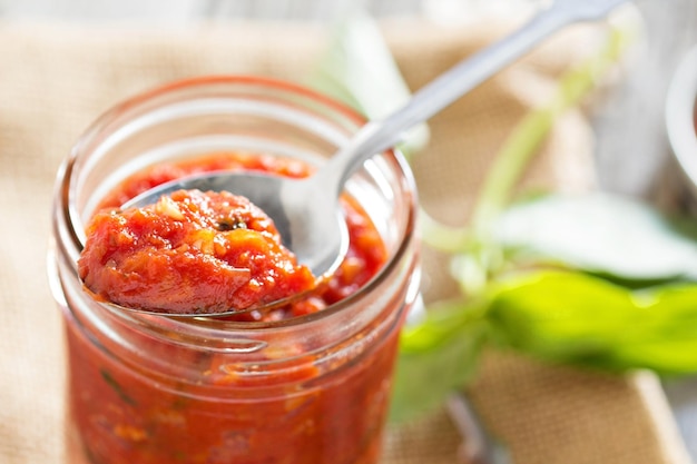 Free photo pizza sauce in a jar selective focus