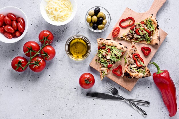 Pizza slices arrangement with vegetables