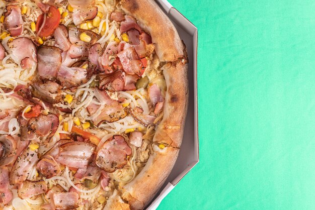 Pizza on the table in green color