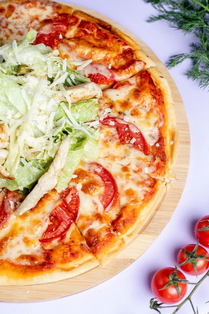 Pizza with extra cheese and greenery