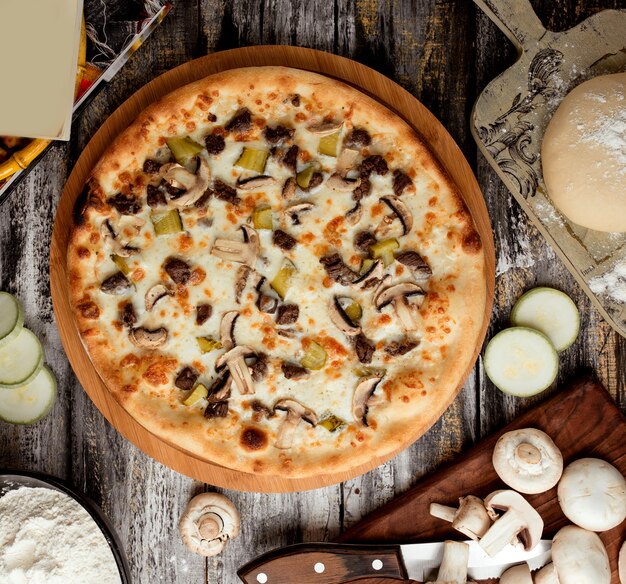 Pizza with meat and mushrooms