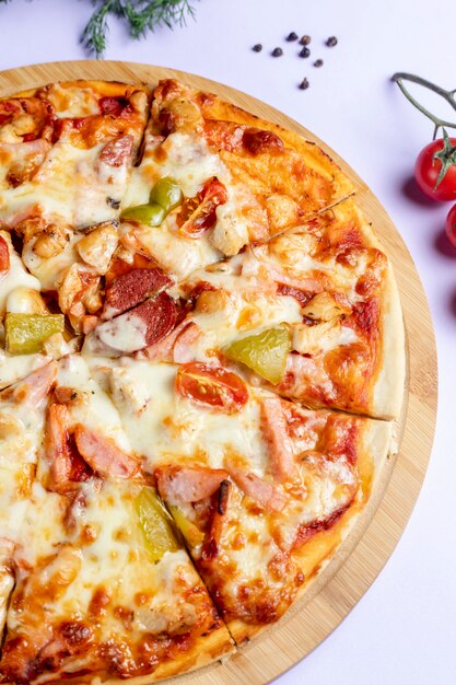 Pizza with sausages and vegetables